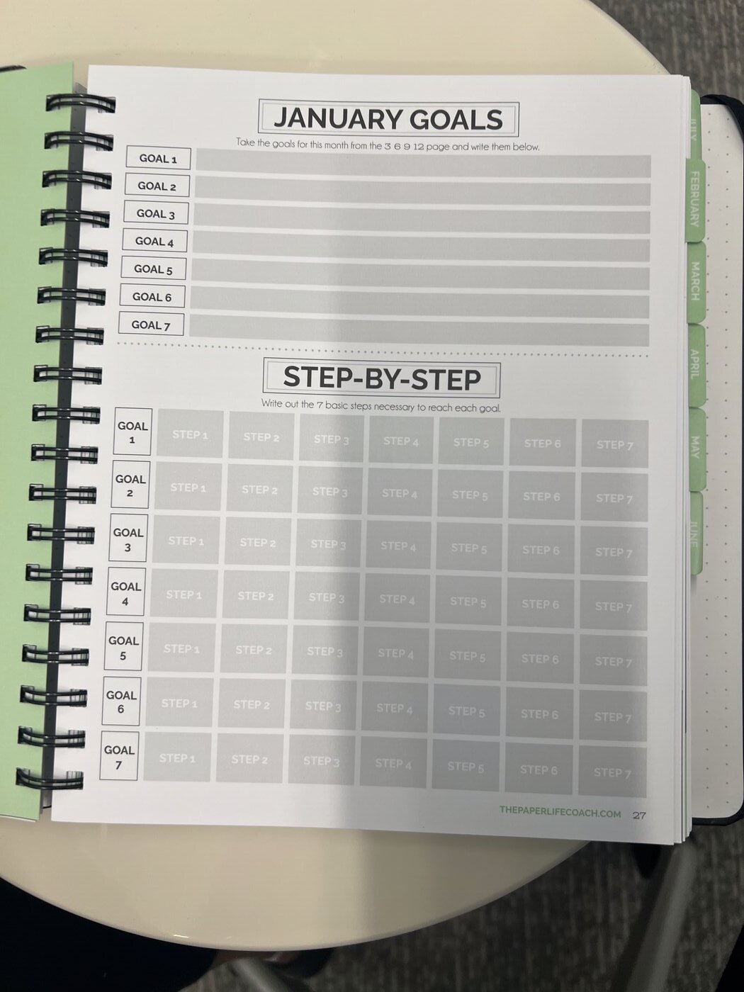 Monthly goal and step-by-step planning spread inside The Paper Life Coach
